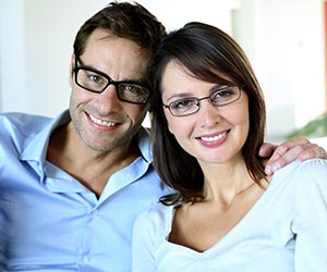 young-couple-smiling-managing-investment-property