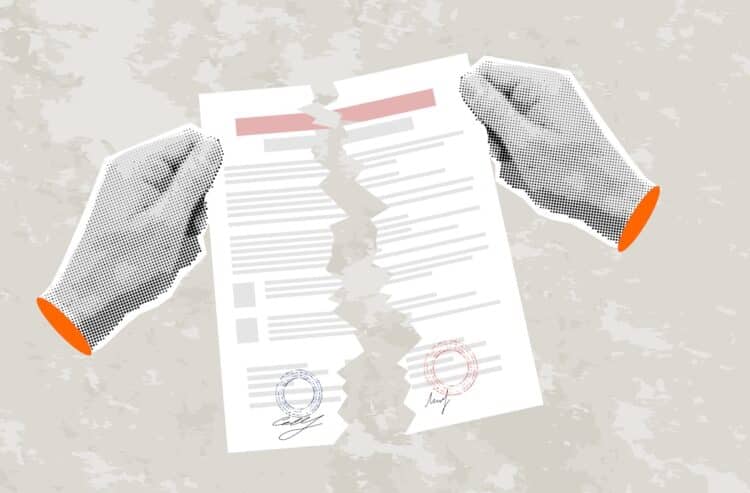 Hands tearing up contract