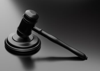 Image of black gavel on black background, ASIC bans 12th MWL adviser